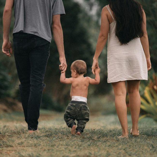 Parents walking with child